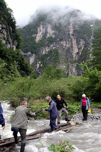 Crossing a stream in the Hengduan Mountains
